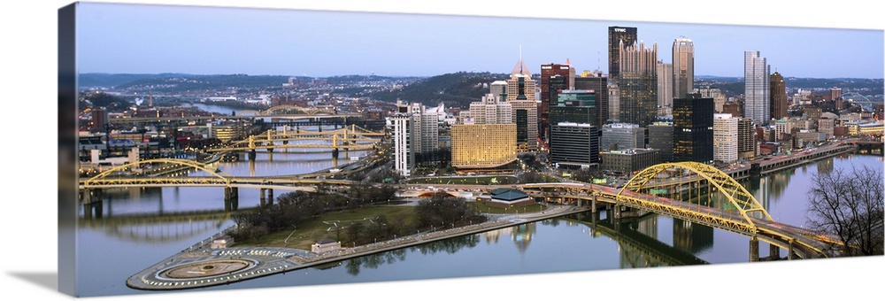 Skyscrapers and bridges in Pittsburgh, Pennsylvania, at nightfall.