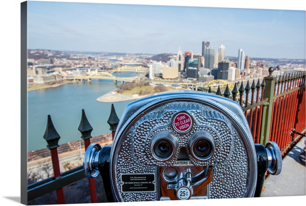 View of downtown Pittsburgh with coin-operated binoculars or tower viewer in the foreground.