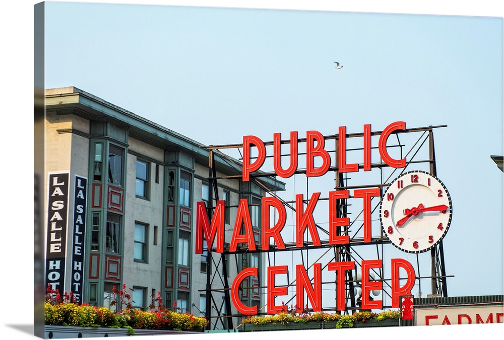 Photograph of the red Public Market Center sign at the farmers market in downtown Seattle.