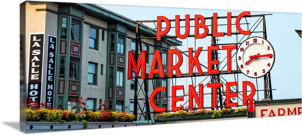 Panoramic photograph of the red Public Market Center sign at the farmers market in downtown Seattle.
