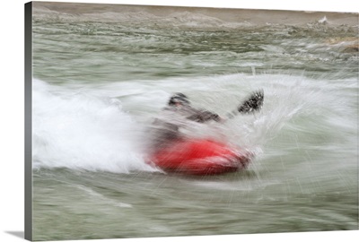 Red Kayaker paddling through Whitewater Rapids - II