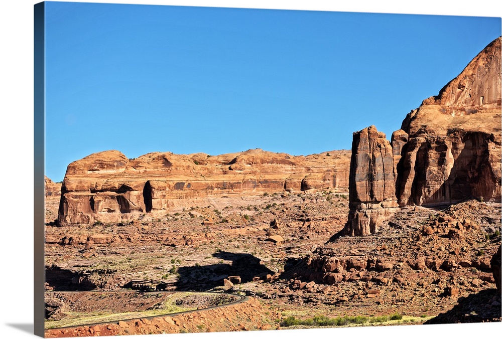 Red Rock cliffs made of eroded sandstone in the desert landscape of Arches National Park, Moab, Utah.