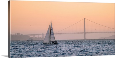 Sailboat Floats In Pacific With Golden Gate Bridge, San Francisco