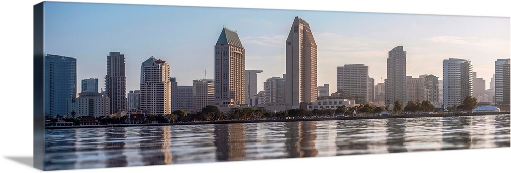 Panoramic photograph of the San Diego, California skyline from the water just before sunset.