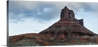 Sandstone tower under a cloudy sky in Arches National Park, Utah