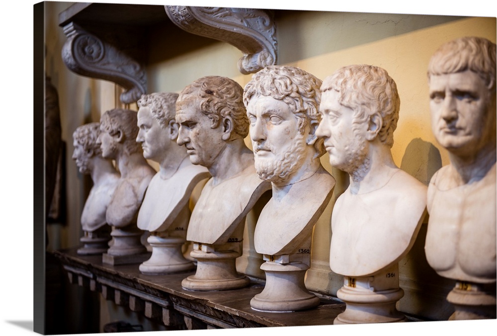 Photograph of sculptures in a row inside the Vatican History Museum.