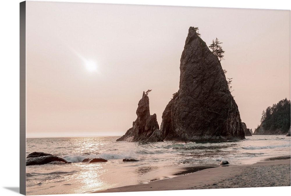 Vertical columns of rock scatter beaches near Olympic National Park, Washington.
