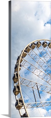 SkyView Atlanta, a giant Ferris Wheel in Centennial Park, against a cloudy sky.