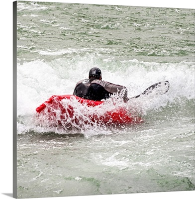 Square View Of Red Kayaker paddling through Whitewater Rapids