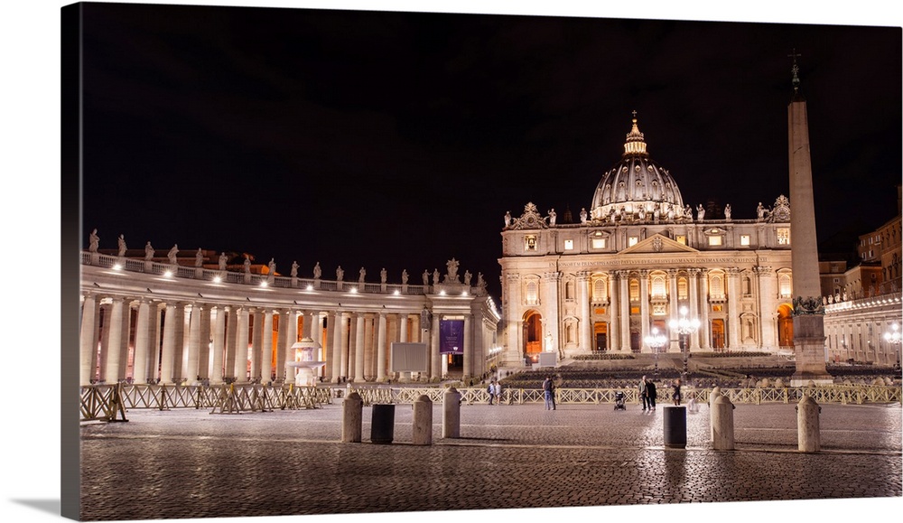 Photograph of St. Peter's Basilica at St. Peter's Square in Vatican City at night.