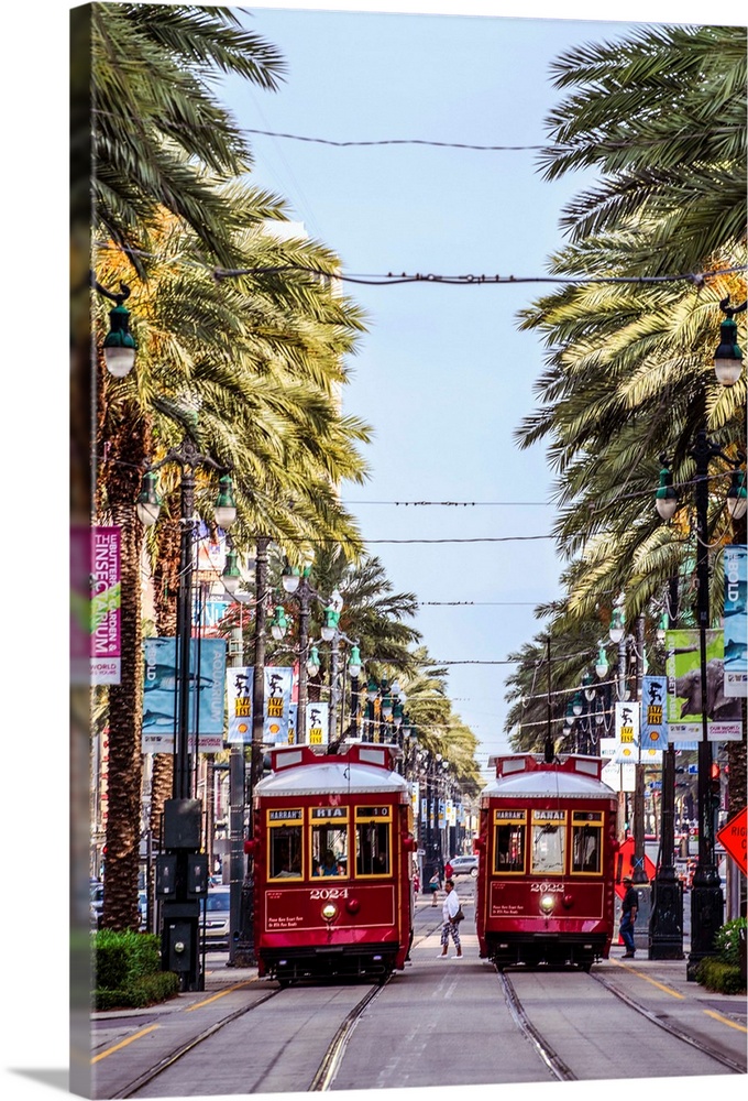 Two streetcars pass each other in New Orleans, Louisiana.