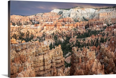 Sunlight illuminating the red striped hoodoos in Bryce Canyon Amphitheater, Utah