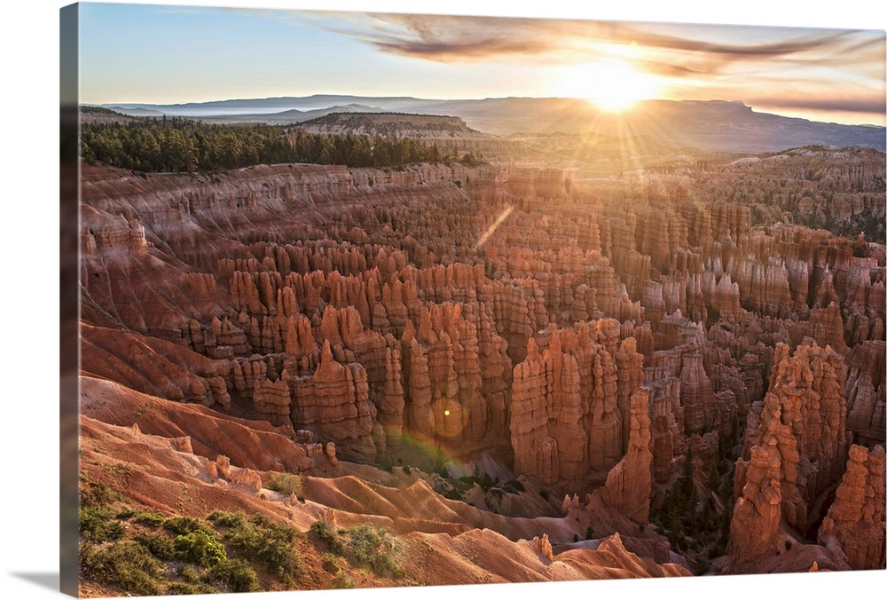 The sun on the horizon, seen from Bryce Canyon Amphitheater in Bryce Canyon National Park, Utah.