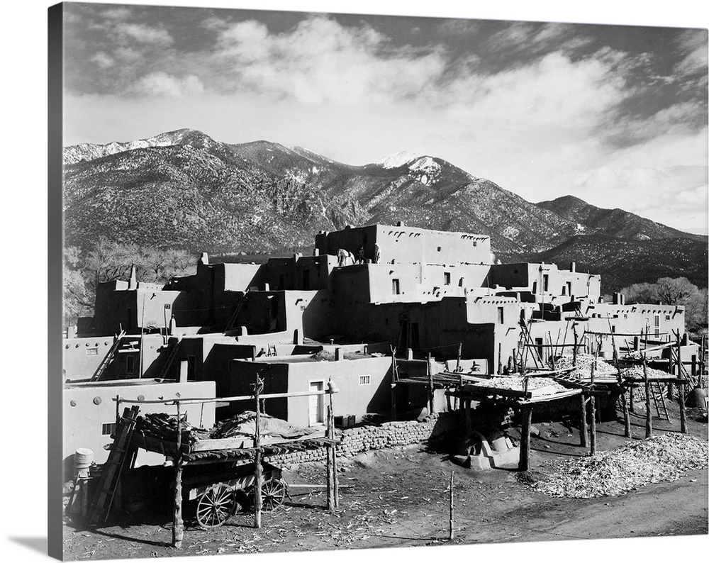 Taos Pueblo, New Mexico, 1941, full view of city, mountains in background.