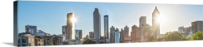 The sun shining just behind a skyscraper in the Atlanta, Georgia skyline