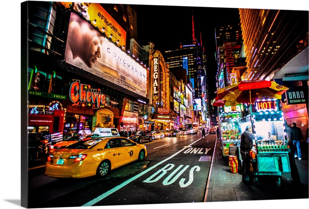 View of advertising signs on 42nd street in New York city at night.