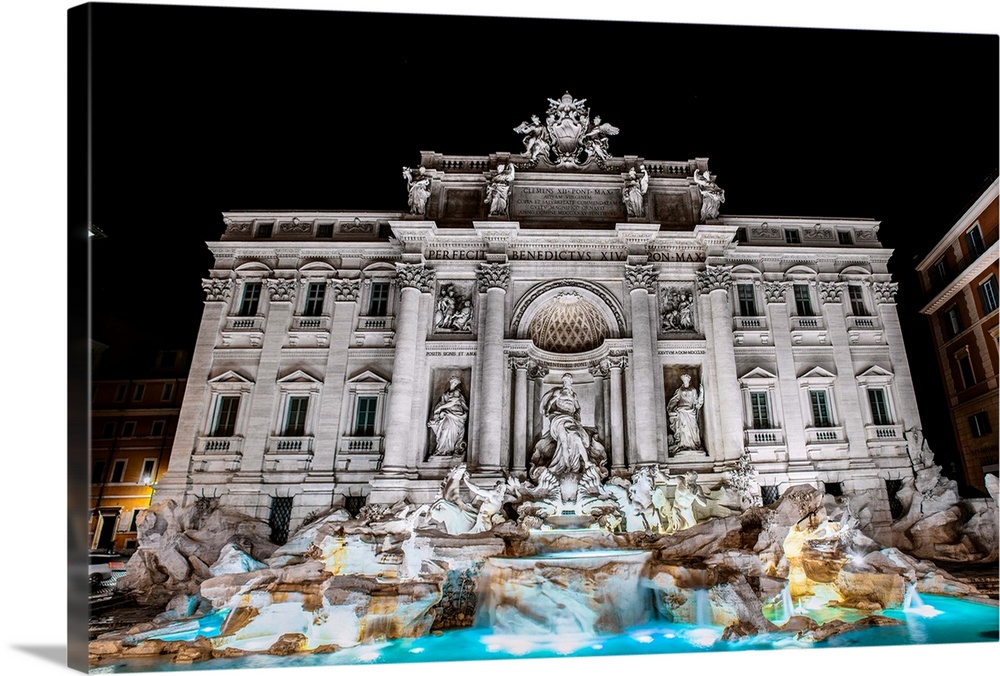 Photograph of the Trevi Fountain in the Trevi district in Rome, Italy, at night.