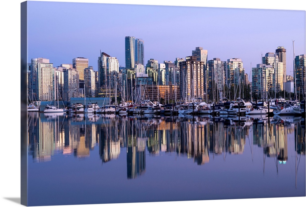 Photograph of a purple sunset over the Vancouver skyline and harbor reflecting onto the False Creek River, British Columbi...