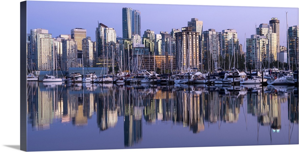 Photograph of a purple sunset over the Vancouver skyline and harbor reflecting onto the False Creek River, British Columbi...