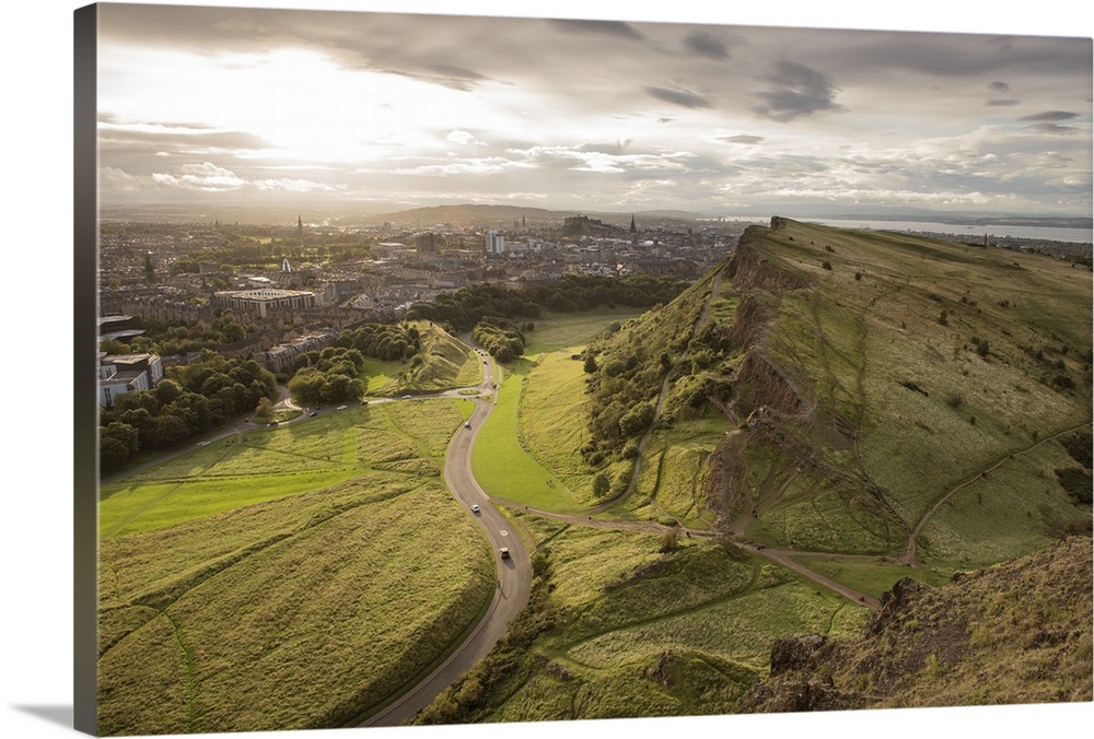 Photograph of Salisbury Crags, Castle Rock, and the city of Edinburgh, Scotland from Holyrood Park.