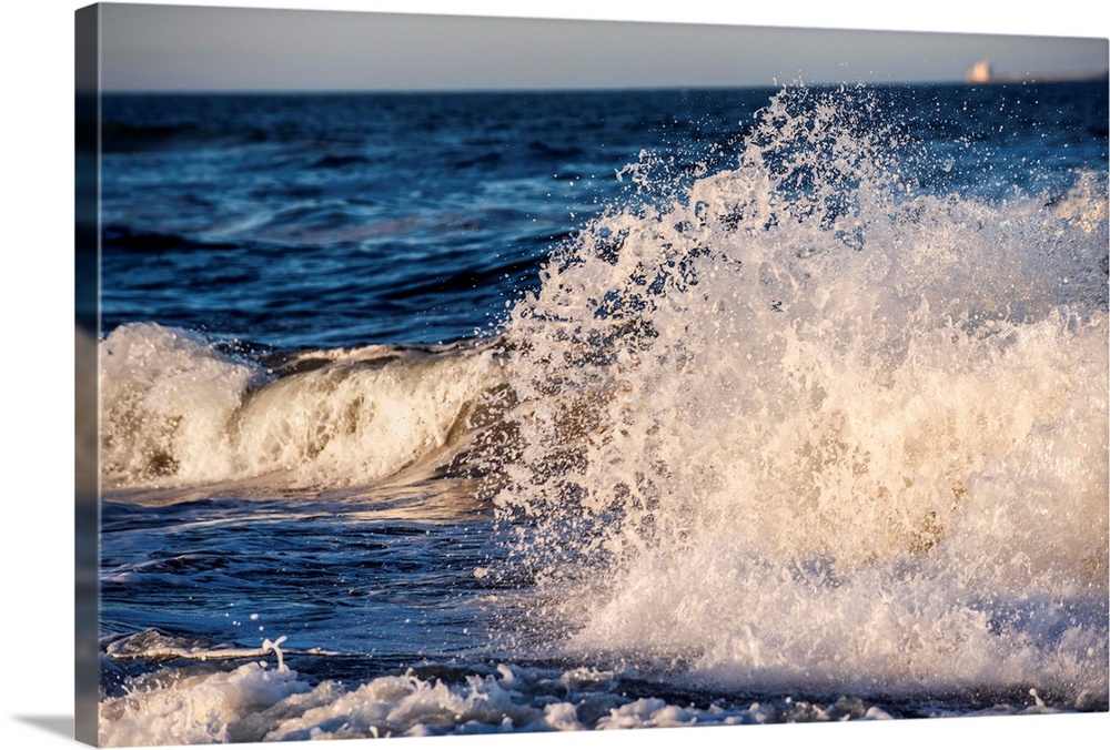Atlantic ocean waves crash onto Virginia's sandy beach.