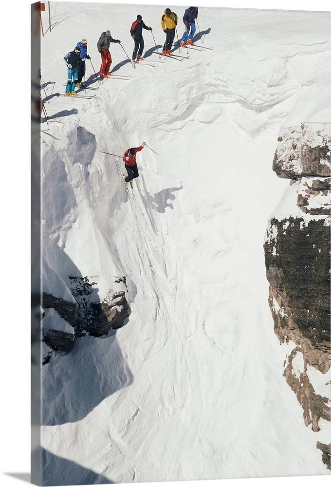 Skilled skiers plunge more than 15 feet in Corbet's Couloir.