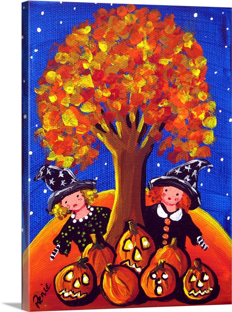 Two little witches are peeking out from behind a colorful fall tree. A grouping of Jack-O-Lanterns sits in front of them.