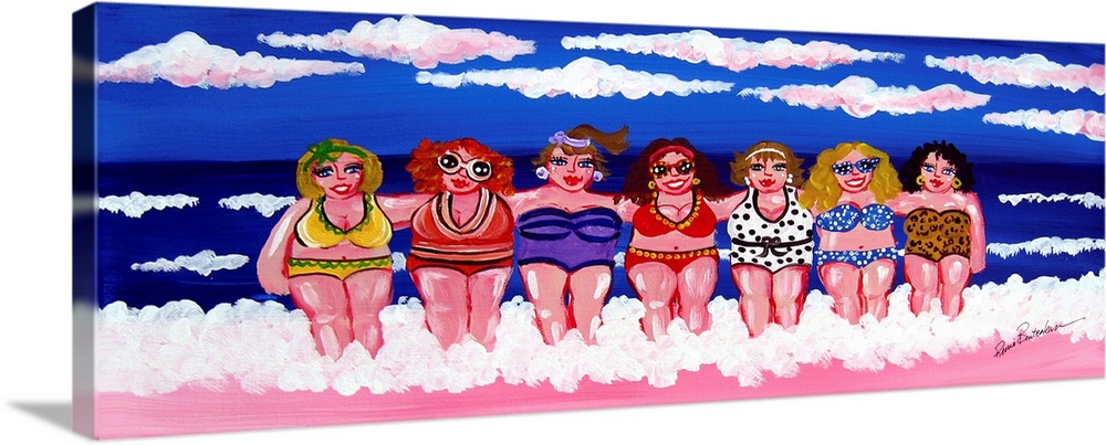 A group of women are enjoying themselves in the surf and sand, under blue skies, at the beach.