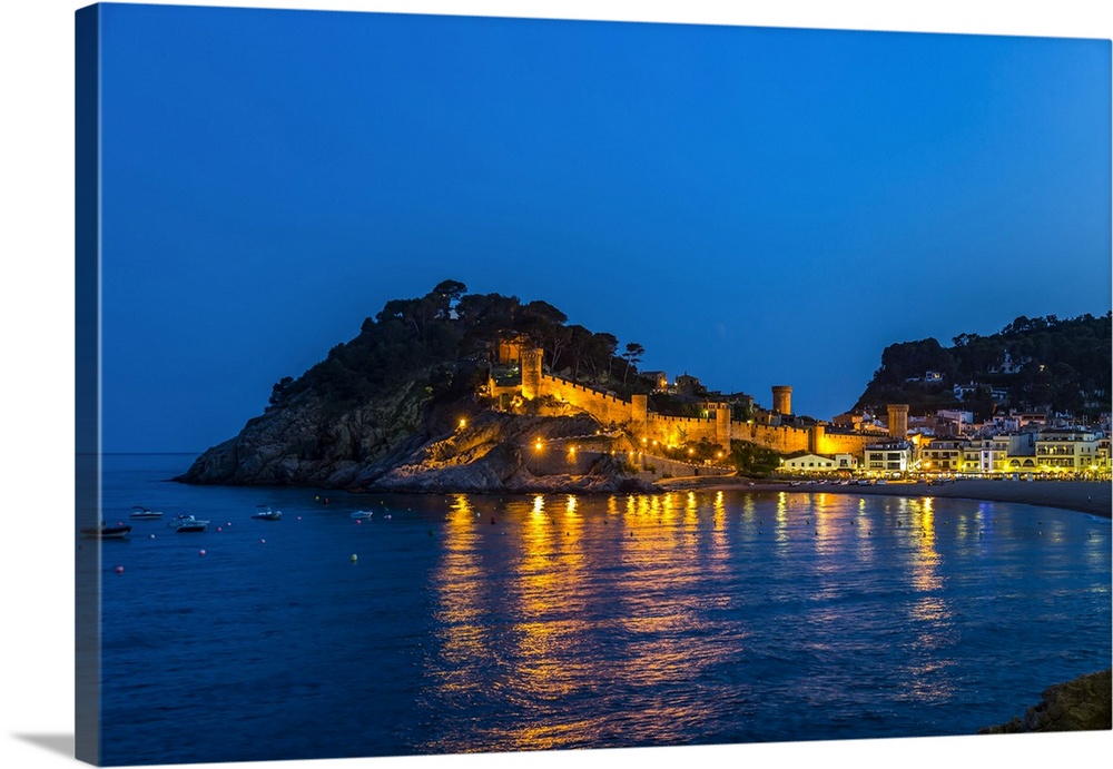 Night view from Tossa de Mar of Castell de Tossa, which was built in 1187; Tossa de Mar, Girona, Spain
