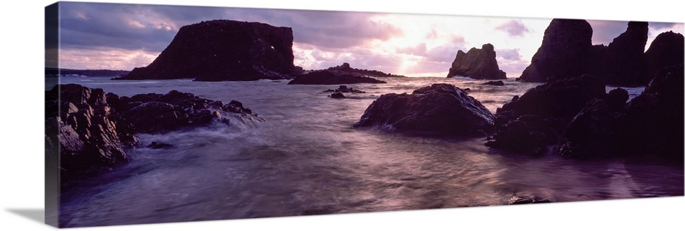 Rocks in the sea at sunset, Whiterocks, Co Antrim, Ireland.