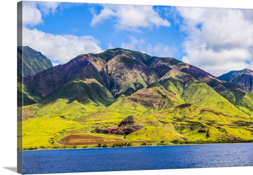 The rugged landscape of the island of Maui under a blue sky with cloud, Maui, Hawaii, United States of America