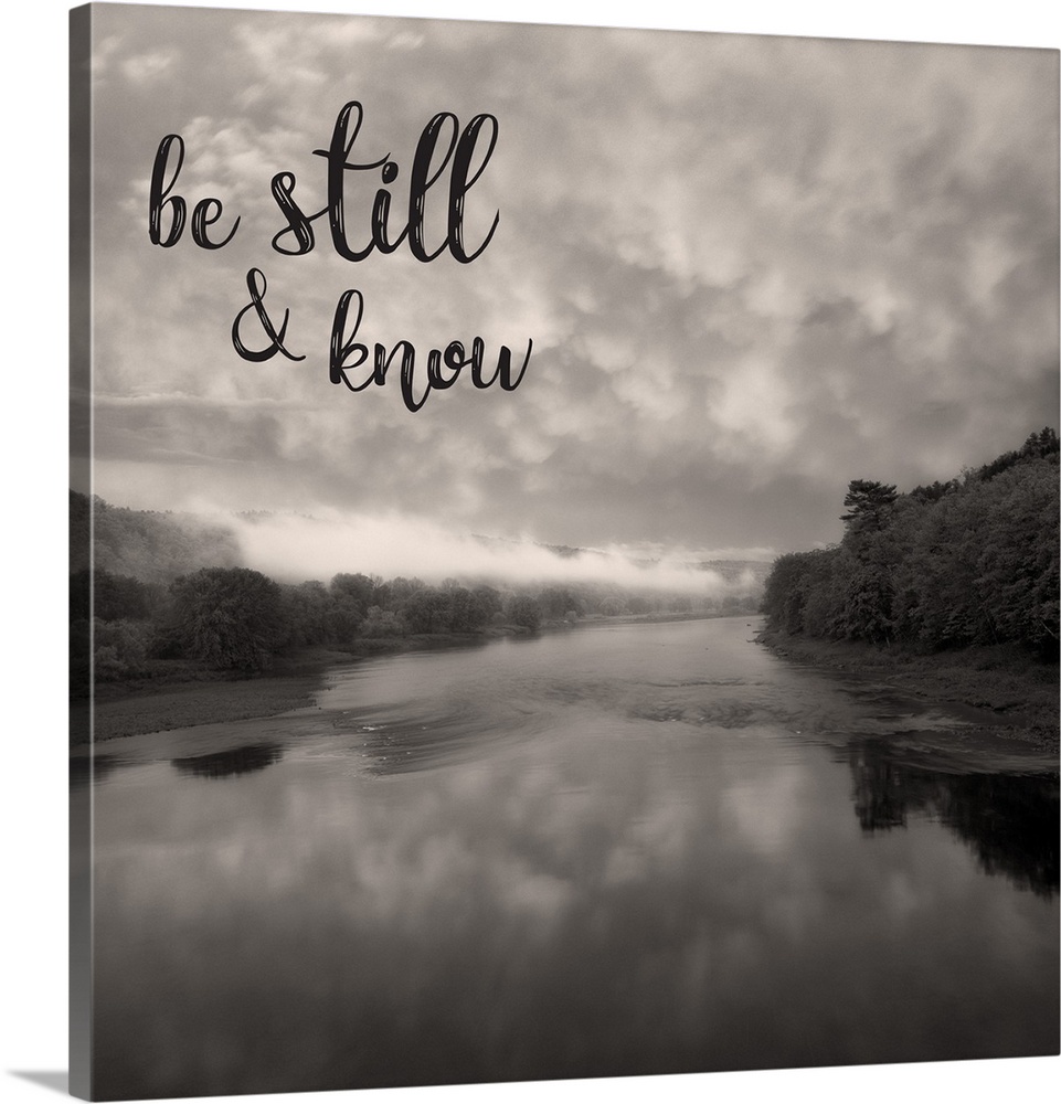 "Be Still & Know" over an image of a lake with a cloud filled sky reflecting in the water.