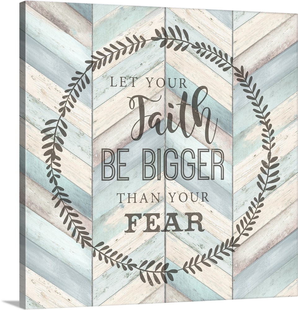 "Let your faith Be Bigger Than Your Fear" surround by a wreath on a chevron wood background.