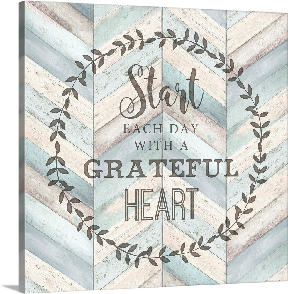 "Start Each Day With A Grateful Heart" surround by a wreath on a chevron wood background.