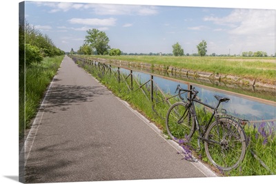 A bike on the Naviglio Pavense canal which links Milan to Pavia, Lombardy, Italy