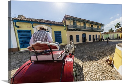 A horse-drawn cart known locally as a coche in Plaza Mayor, Trinidad, Cuba