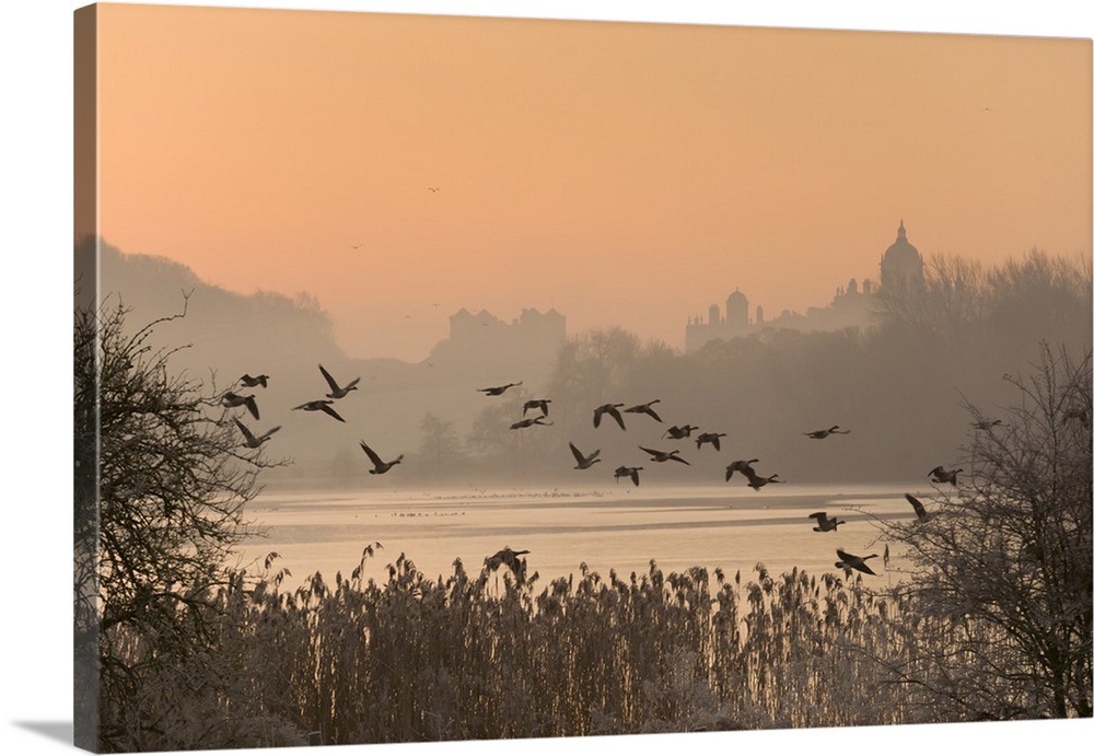 A misty sunrise over the Great Lake on the Castle Howard Estate, North Yorkshire, Yorkshire, England, United Kingdom, Europe