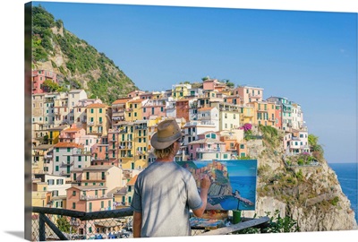 A painter at Manarola, Cinque Terre, Liguria, Italian Riviera, Italy