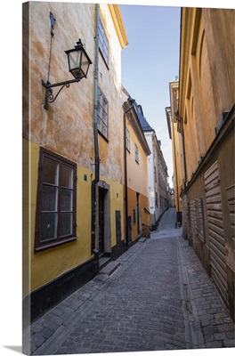 A pedestrian walks the streets of Stockholm's historic Gamla Stan district, Stockholm