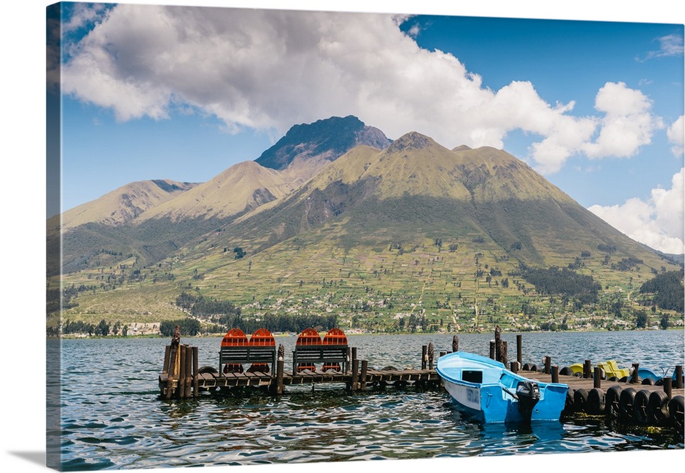 A pier and boat at the base of Volcan Imbabura and Lago San Pablo, close to the famous market town of Otovalo, Ecuador