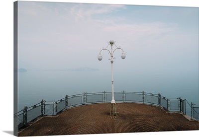 A symmetrical spot with a lamp overlooking Lake Maggiore, Piedmont, Italian Lakes, Italy