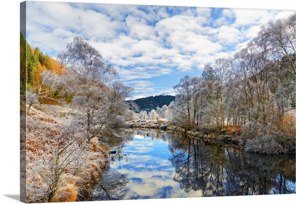 A tranquil view of Loch Doilet and surrounding trees on a calm and frosty winter morning in the Ardnamurchan Peninsula, Sc...