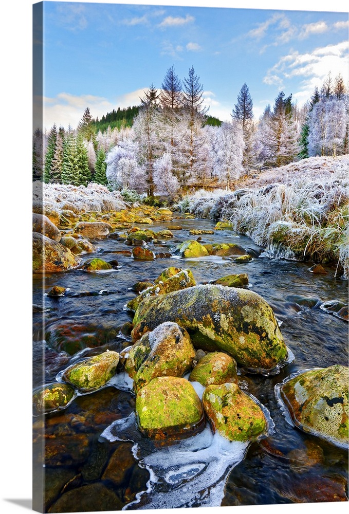 A winter view of the flowing water and colourful rocks of the River Polloch in the Ardnamurchan Peninsula, Scottish Highla...