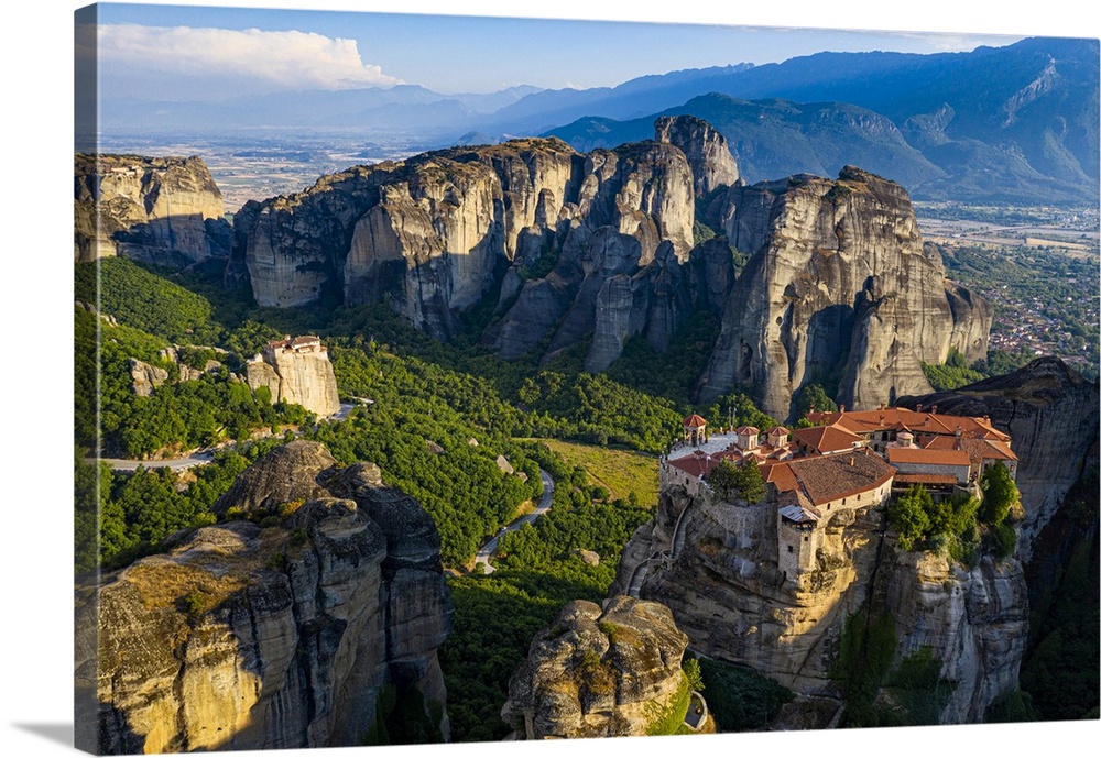 Aerial by drone of the Holy Monastery of Varlaam at sunrise, UNESCO World Heritage Site, Meteora Monasteries, Greece, Europe