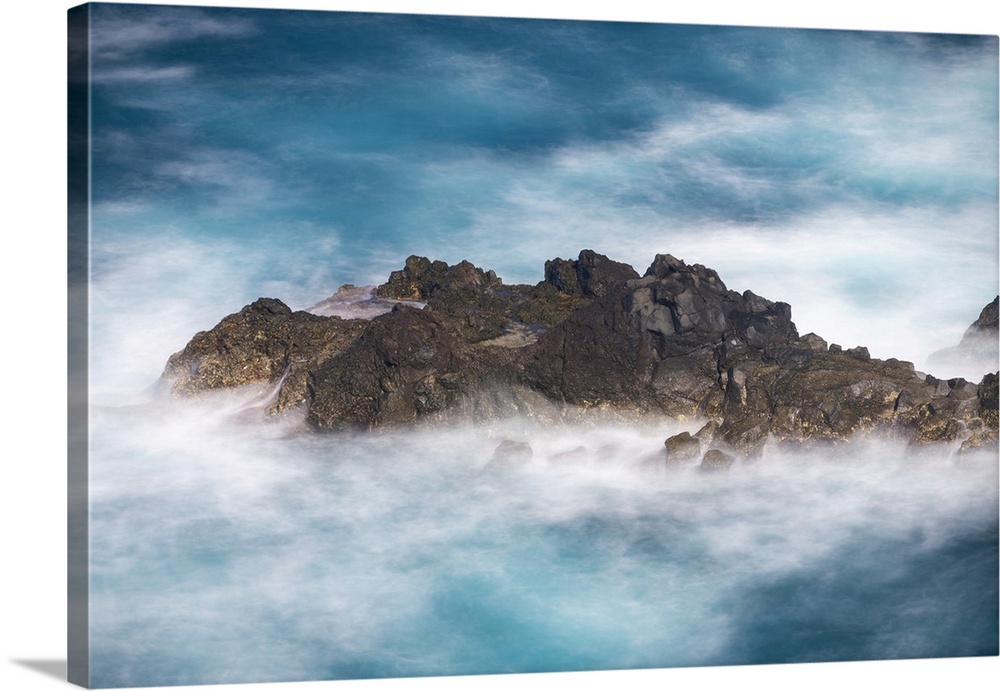 Aerial view of small rock island amongst waves, Madeira, Portugal, Atlantic, Europe