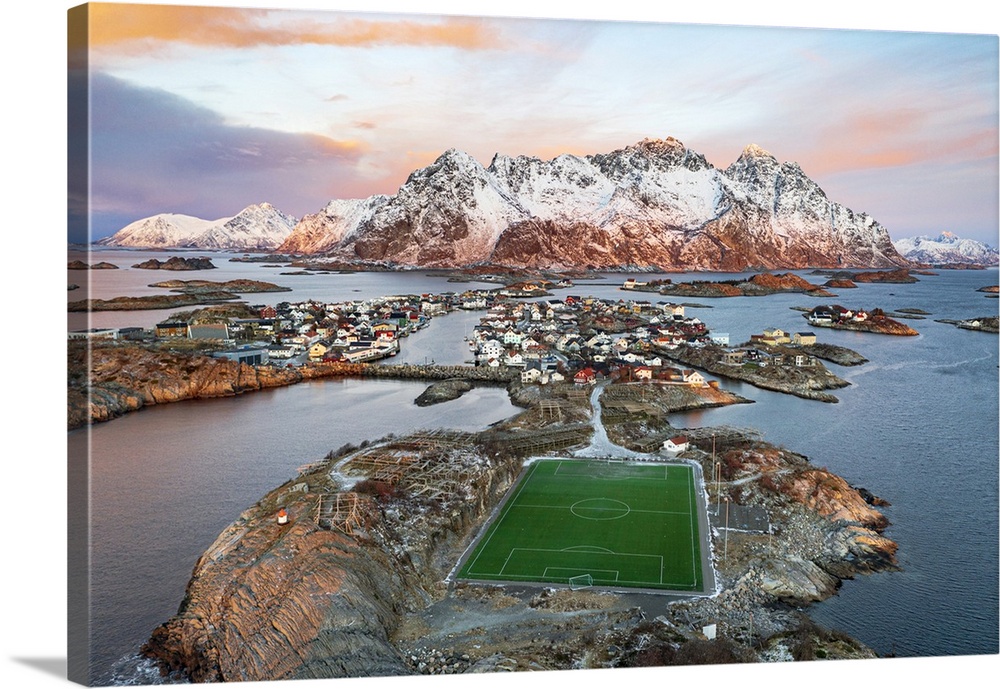 Aerial view of soccer stadium and Henningsvaer village during winter dawn, Nordland county, Lofoten Islands, Norway, Scand...