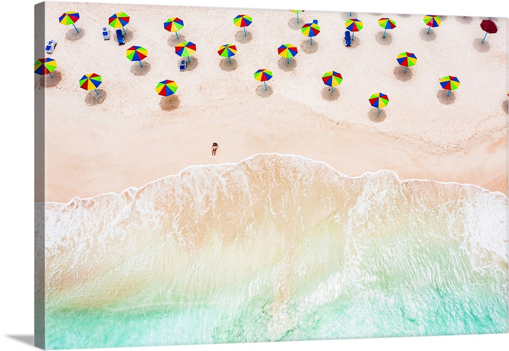 Aerial view of woman sunbathing on a tropical beach, Antigua, West Indies, Caribbean, Central America