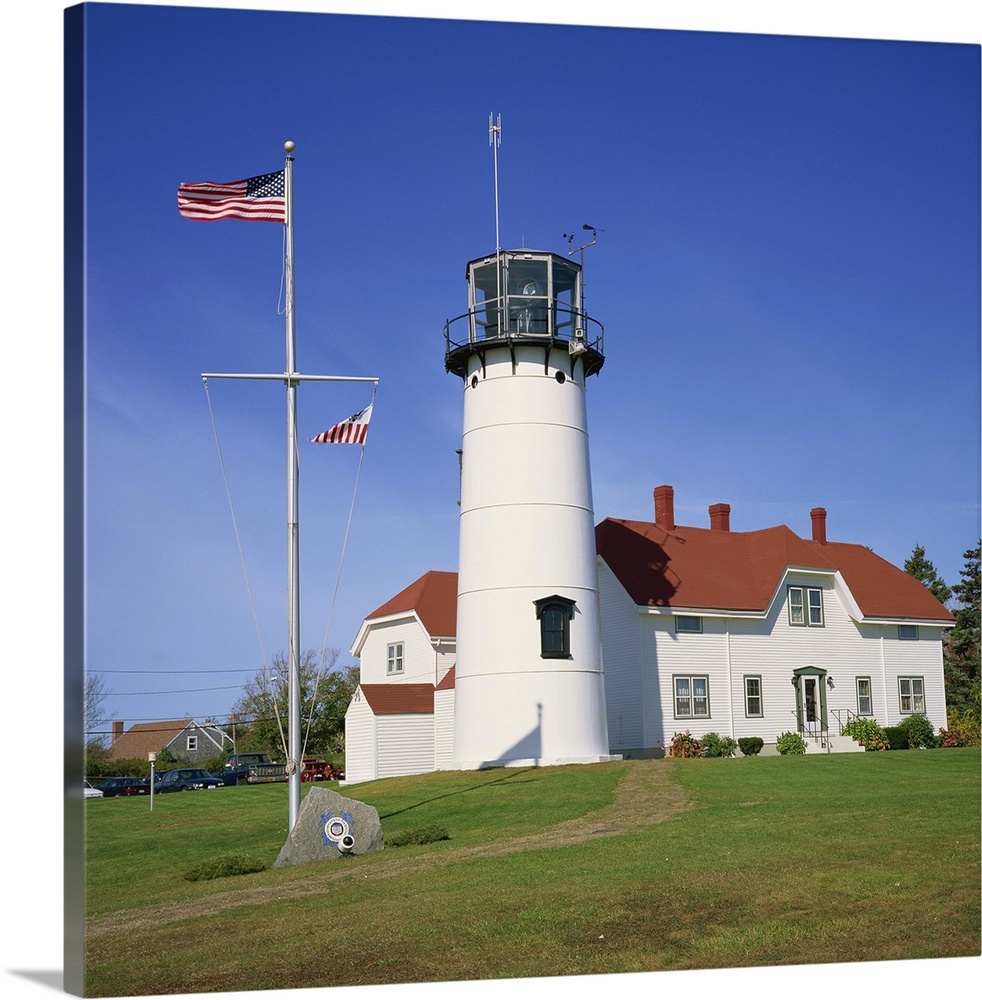 American flag flying beside the Chatham lighthouse, Cape Cod, Massachusetts