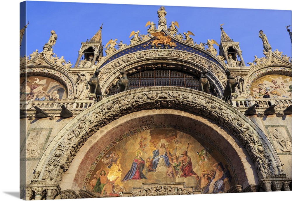 Basilica San Marco golden exterior mosaics in late afternoon sun in winter, Venice, Veneto, Italy