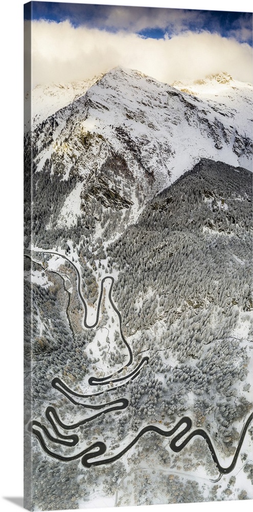 Bends of Maloja Pass road on snowy mountain ridge, aerial view, Bregaglia Valley, Engadine, canton of Graubunden, Switzerl...